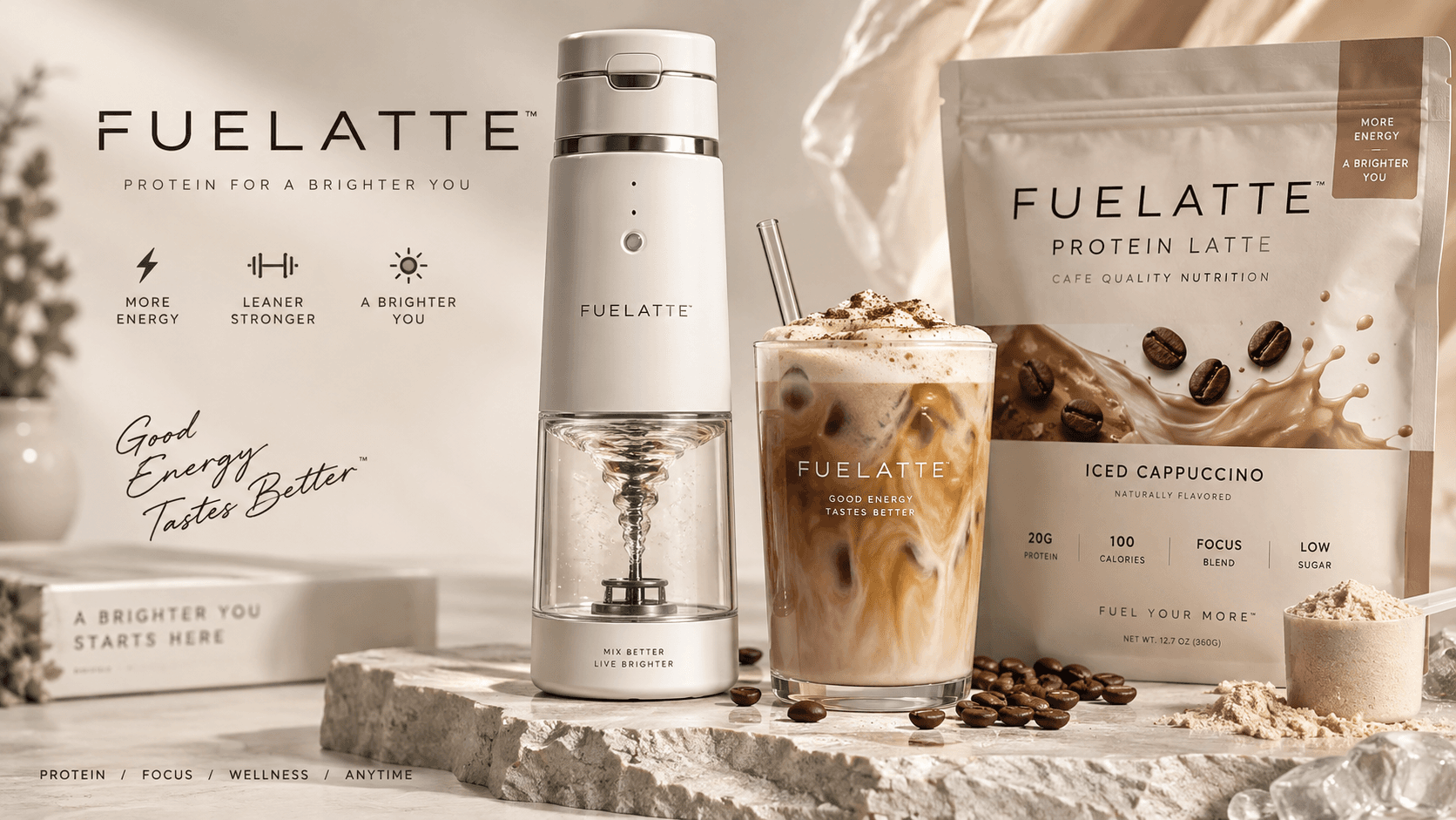 FUELATTE electric mixer beside an iced cappuccino protein latte and a pouch of Iced Cappuccino on a stone counter